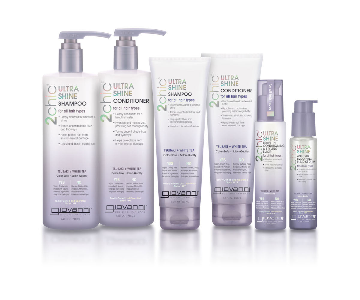 Six Giovanni 2chic Ultra Shine hair care products in white and silver bottles and tubes, including shampoo, conditioner, and leave-in treatments, displayed in a row on a white background.