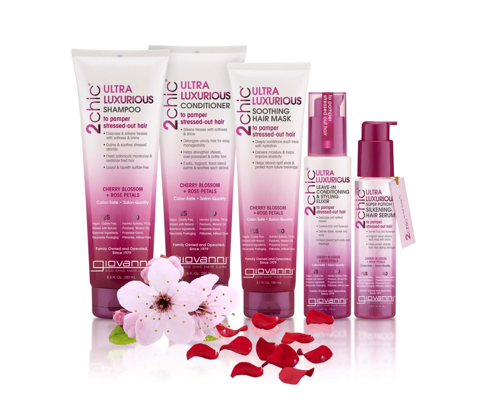 Six Giovanni 2chic Ultra Luxurious hair care products are displayed with scattered cherry blossom petals and a cherry blossom flower on a white background.