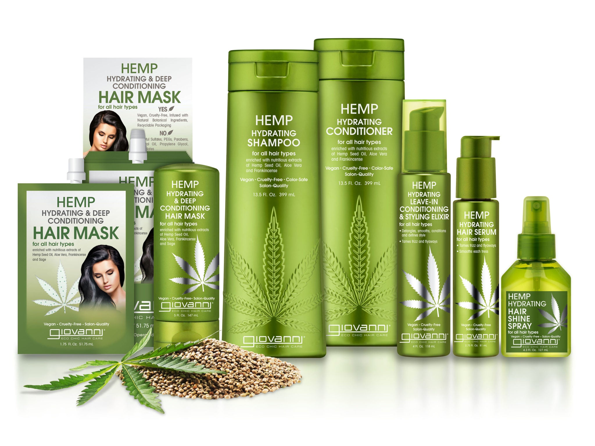 A collection of Giovanni hair care products in green bottles, labeled Hemp, including shampoo, conditioner, hair mask, hair serum, shine spray, styling elixir, and hemp seeds, with hemp leaves as decoration.