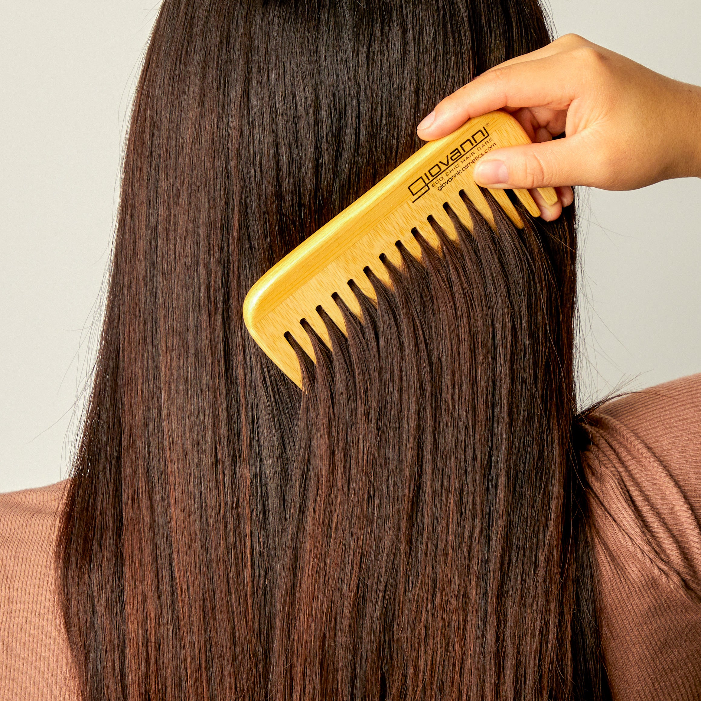 Woman using Giovanni comb