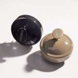 Two Giovanni Cosmetics SCALP MASSAGER & SHAMPOO BRUSHES (Tan Handle) rest on a white surface—ideal for stress relief and natural hair care.