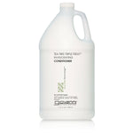 A gallon-sized bottle of Giovanni TEA TREE TRIPLE TREAT INVIGORATING CONDITIONER