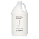 A gallon-sized bottle of Giovanni SMOOTH AS SILK Deeper Moisture Conditioner