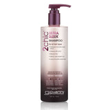 A bottle of Giovanni Cosmetics 2chic® ULTRA-SLEEK SHAMPOO, available in 2 sizes, features a color-safe, sulfate-free formula suitable for all hair types. The white and purple pump-top design emphasizes its smoothing benefits.