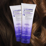 Two tubes of Giovanni Cosmetics 2chic® REPAIRING SHAMPOO rest on wavy brown hair. This salon-quality formula is specially made to revitalize and repair damaged hair.