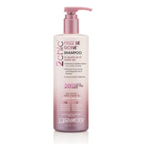 A pink and white bottle of Giovanni Cosmetics 2chic® FRIZZ BE GONE™ SHAMPOO (available in 2 sizes), sulfate-free with a pump, for frizz control, enriched with shea butter and sweet almond oil.