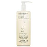 A bottle of Giovanni Cosmetics TEA TREE TRIPLE TREAT™ INVIGORATING SHAMPOO features a pump dispenser and beige label, highlighting this color-safe, paraben-free formula’s salon-quality and eco-friendly benefits. Available in 2 sizes.