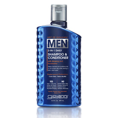 A blue bottle of Giovanni Cosmetics MEN 2-in-1 Daily Shampoo & Conditioner with Ginseng & Eucalyptus, a men’s hair cleanser, features textured sides and white text on the label.