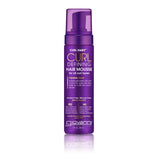 A purple bottle of Giovanni Cosmetics CURL HABIT™ CURL DEFINING HAIR MOUSSE with a pump dispenser, made for all curl types and flexible hold. This alcohol-free, silicone-free formula with shea butter delivers salon-quality results.