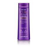 A purple bottle of Giovanni Cosmetics CURL HABIT™ Curl Defining No-Foam Conditioning Shampoo for all curl types with coconut oil, jojoba, and shea butter to moisturize curls. 13.5 fl oz (399 mL).