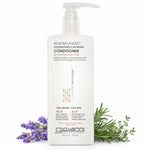 A gallon-sized white bottle of Giovanni Cosmetics 50:50 BALANCED™ HYDRATING-CALMING CONDITIONER stands upright with a pump beside lavender and rosemary sprigs on a white background. This color-safe conditioner hydrates and calms hair.