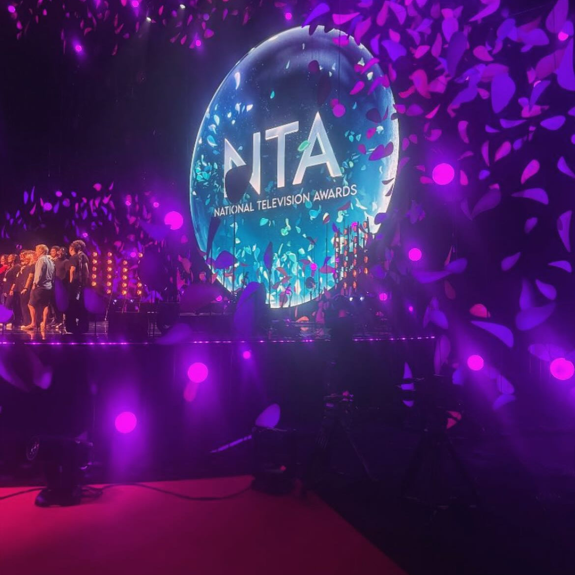 Stage with 'NITA' logo at the National Television Awards, surrounded by confetti.
