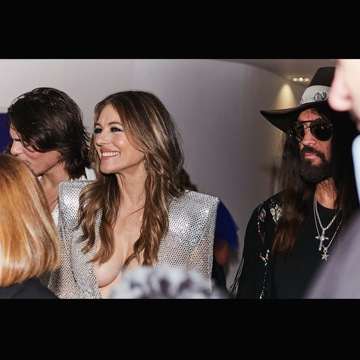 Woman in a silver outfit smiling at National Television Awards