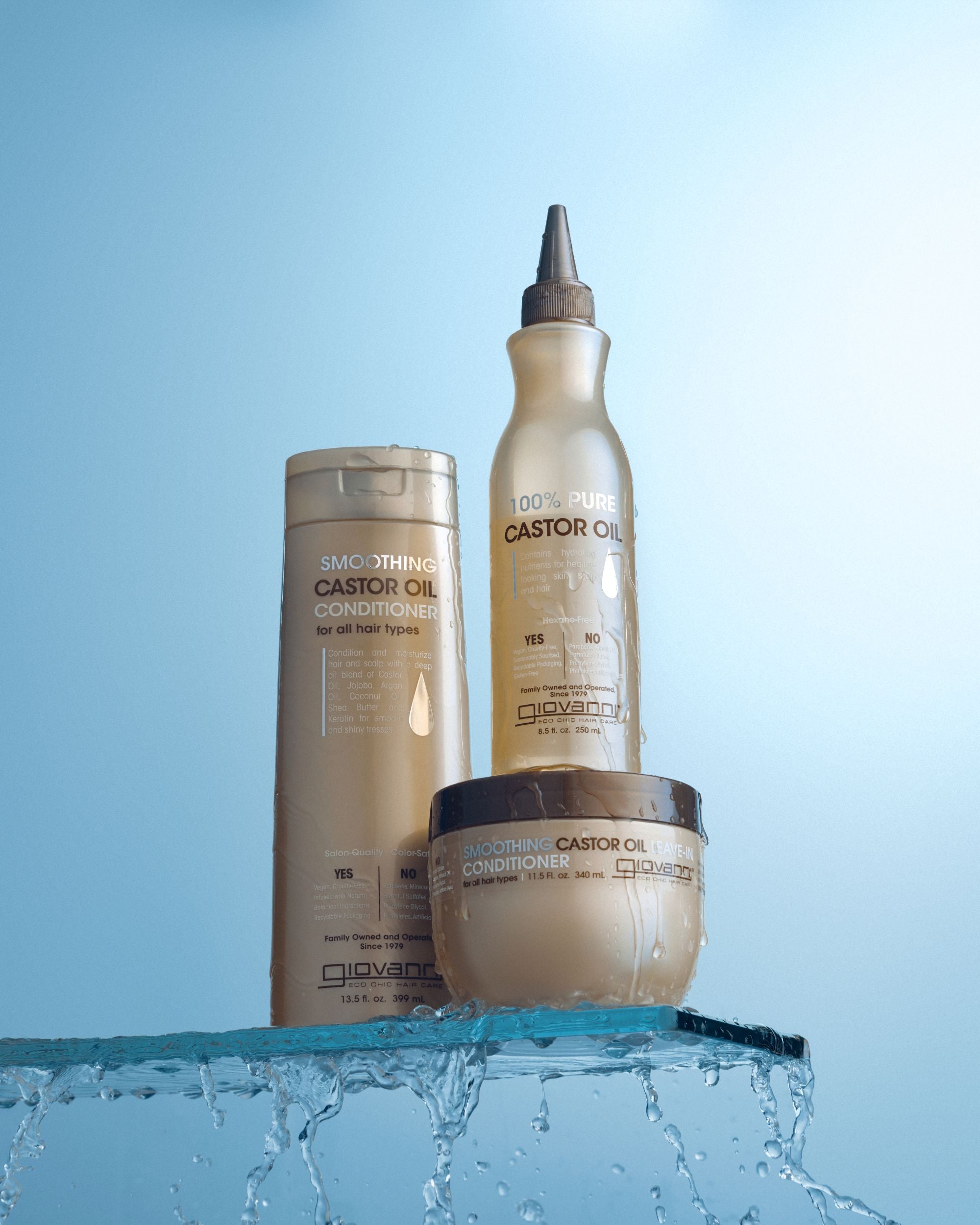 Bottles of Smoothing Castor Oil Conditioner, Hair Mask and 100 percent Castor Oil sitting on glass shelf. 