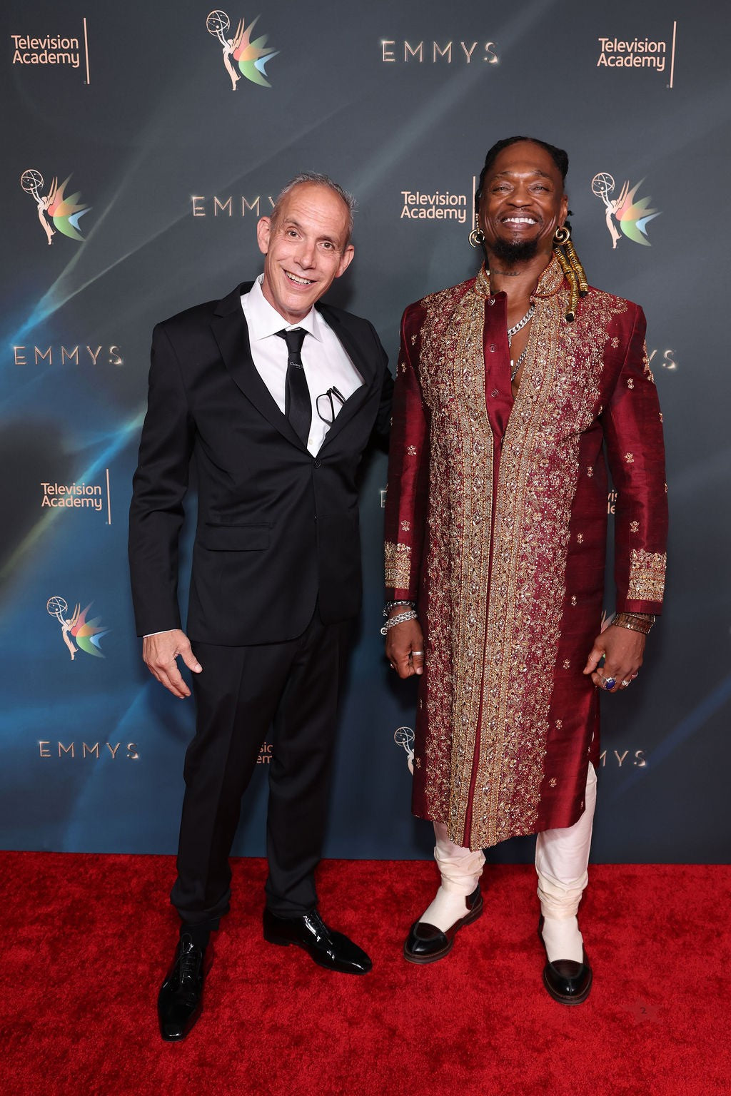 Giovanni Guidotti and Brian Steven Banks posing on the red carpet at the Emmys