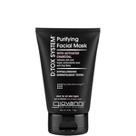 A black tube of Giovanni Cosmetics D:TOX SYSTEM® PURIFYING FACIAL MASK stands upright against a white background, highlighting its detoxifying formula and suitability for all skin types.