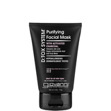 A black tube of Giovanni Cosmetics D:TOX SYSTEM® PURIFYING FACIAL MASK stands upright against a white background, highlighting its detoxifying formula and suitability for all skin types.