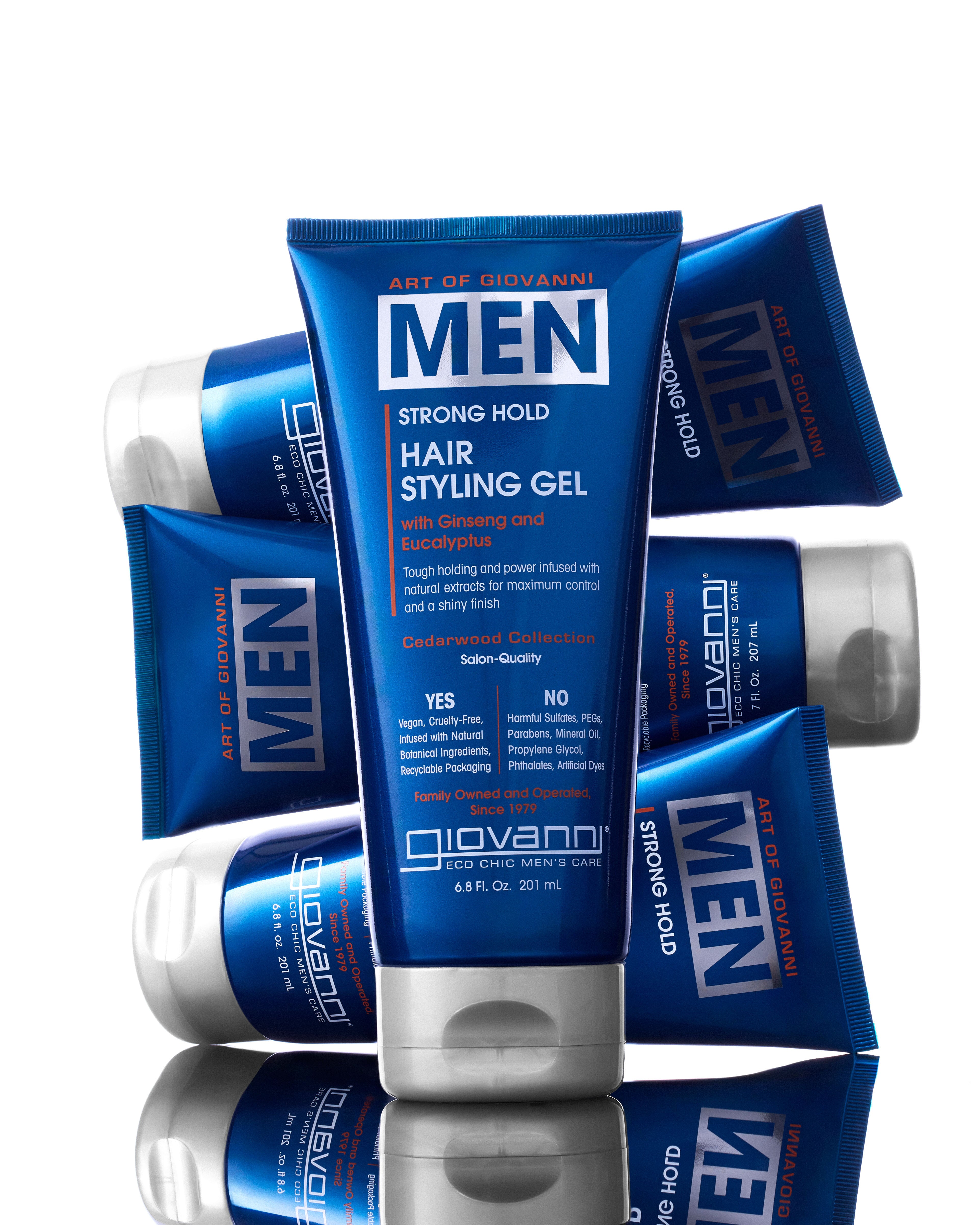 A tube of Giovanni Cosmetics MEN Strong Hold Hair Styling Gel with Ginseng and Eucalyptus stands upright, surrounded by identical blue tubes—showcasing salon-quality hair care and a strong hold formula for men.