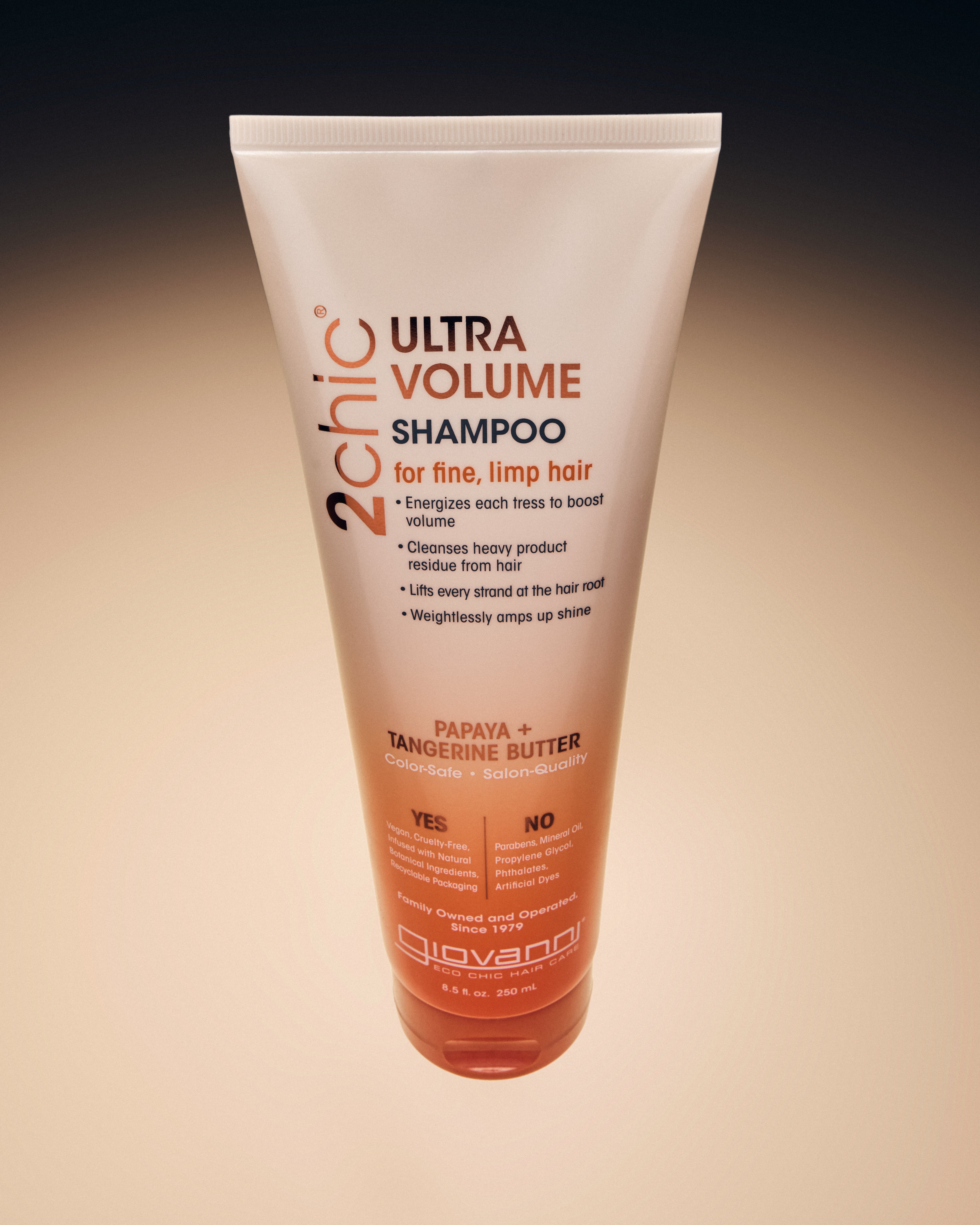 Image of 2chic Ultra Volume Shampoo from above with ombre background.