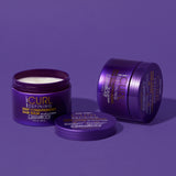 Three purple containers of Giovanni Cosmetics CURL HABIT™ Curl Defining Deep Conditioning Hair Mask are on a purple surface. One jar is open, revealing the curl hydration cream, with another closed jar and a lid beside it.