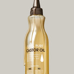 A clear bottle of Giovanni Cosmetics SMOOTHING CASTOR OIL with a pointed applicator cap and labeled details, showing oil drips on the outside, ideal for hair treatment or moisturizing, set against a plain light gray background.