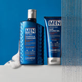 Two blue bottles of Giovanni Cosmetics hair care—2-in-1 Daily Shampoo & Conditioner and MEN Strong Hold Hair Styling Gel with Ginseng and Eucalyptus—stand on a white, sudsy surface by running water, set against a blue background.
