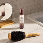 Bottle of Giovanni 2Chic Ultra Sleek Blow-Out Styling Mist and brush