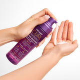 Hands holding Giovanni Curl Defining Hair Mousse