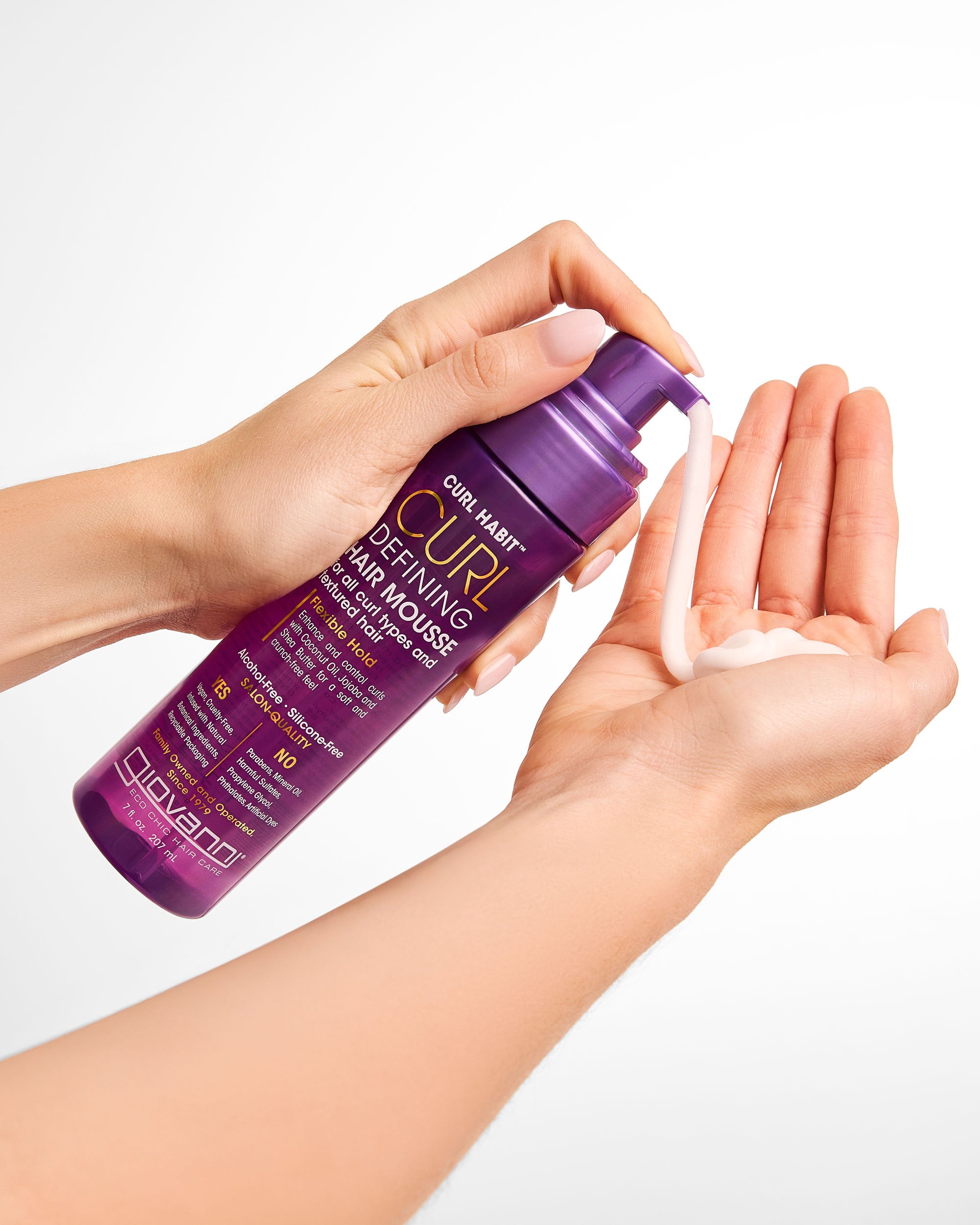 Hands holding Giovanni Curl Defining Hair Mousse