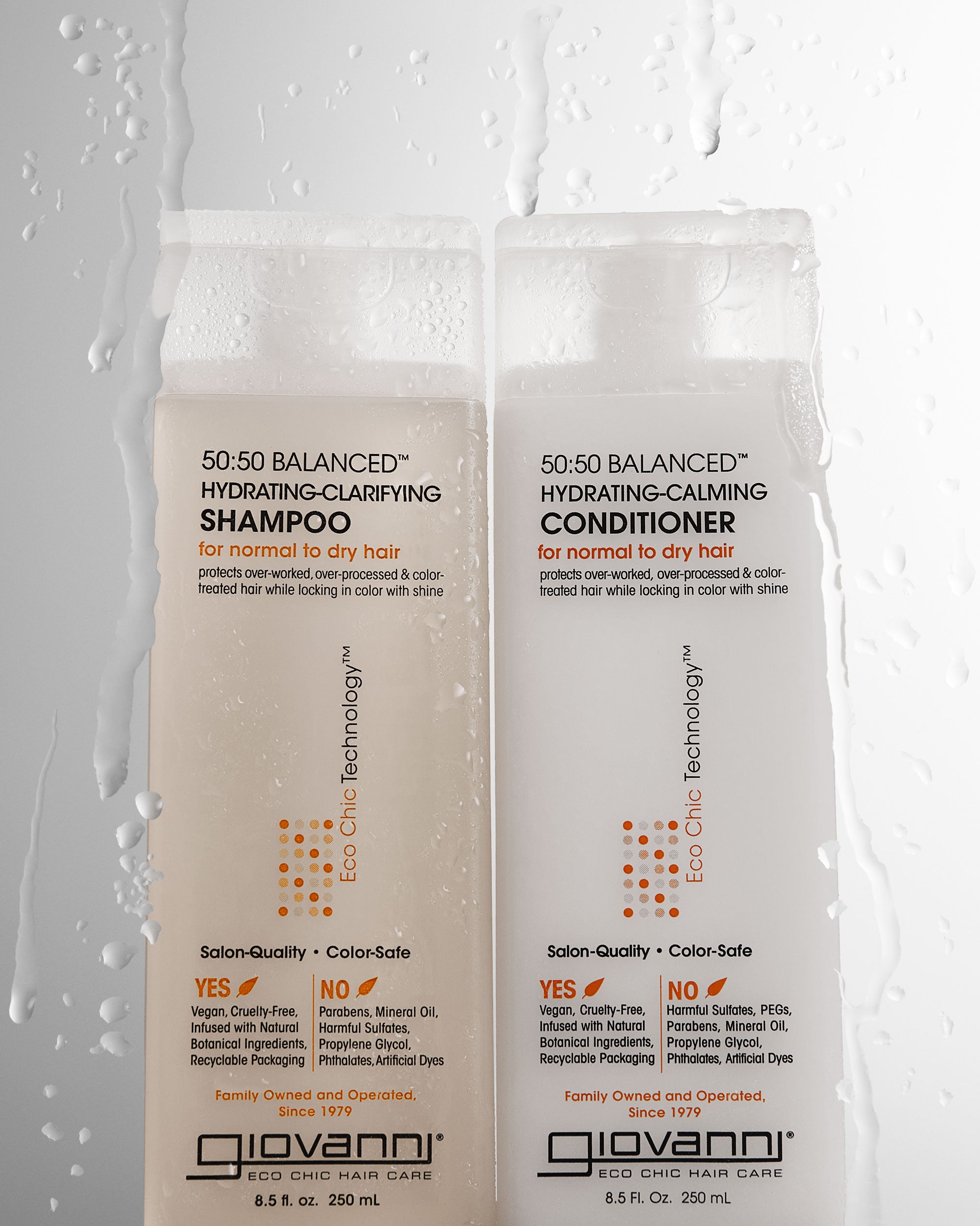 Bottles of 50:50 Balanced Hydrating-Calming Conditioner and Shampoo with drips