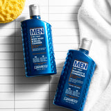 Two bottles of Giovanni Men's hair care products on a checkered surface with a sponge and towel.