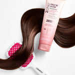 Giovanni 2chic Frizz Be Gone shampoo bottle with a hairbrush on a white background