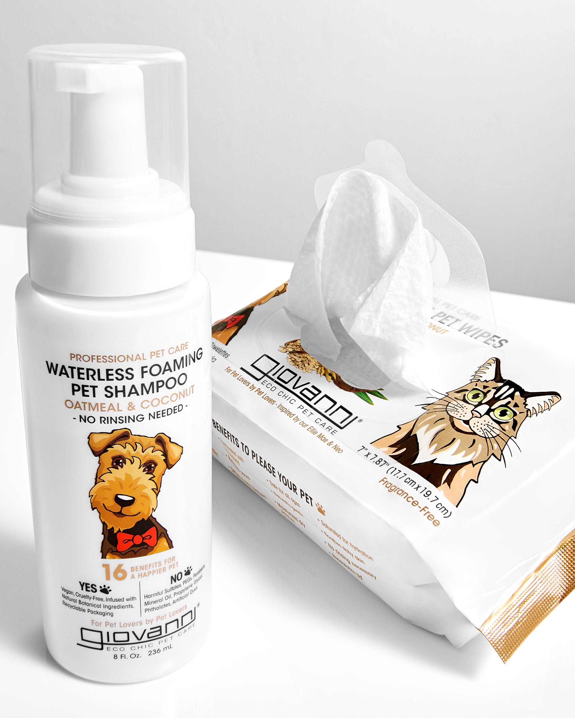 Giovanni pet care products including a bottle of waterless foaming pet shampoo and a packet of wipes on a light gray background.