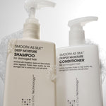Two white pump bottles of Giovanni Cosmetics SMOOTH AS SILK™ DEEPER MOISTURE CONDITIONER, labeled for damaged hair, offer color-safe, silky hydration and appear with bubbles on top against a light background.