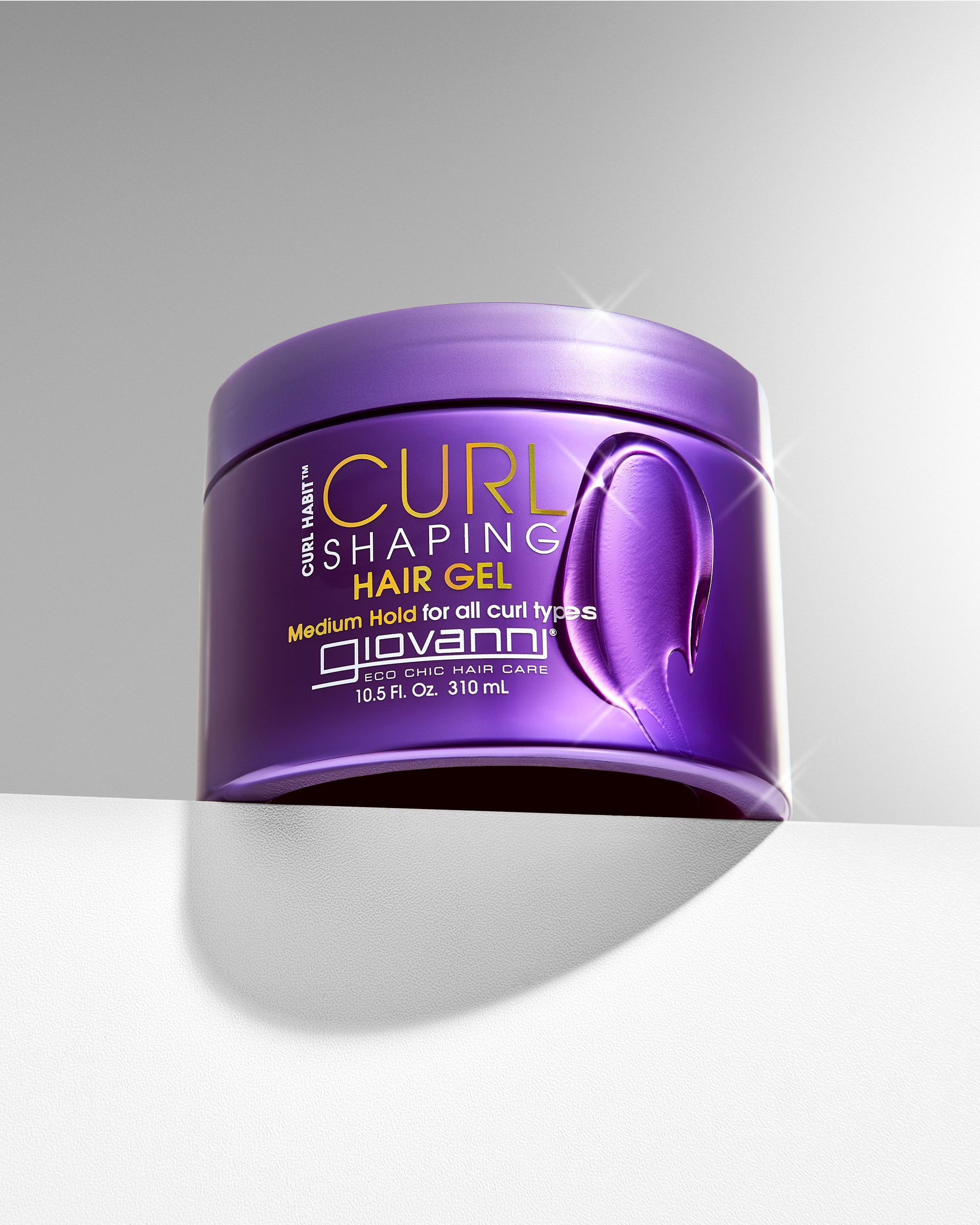 Jar of Giovanni Curl Shaping Hair Gel on a gray background