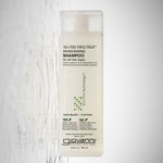Giovanni Tea Tree Triple Treat Shampoo bottle on a light gray background