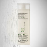 Giovanni Tea Tree Triple Treat Shampoo bottle on a light gray background