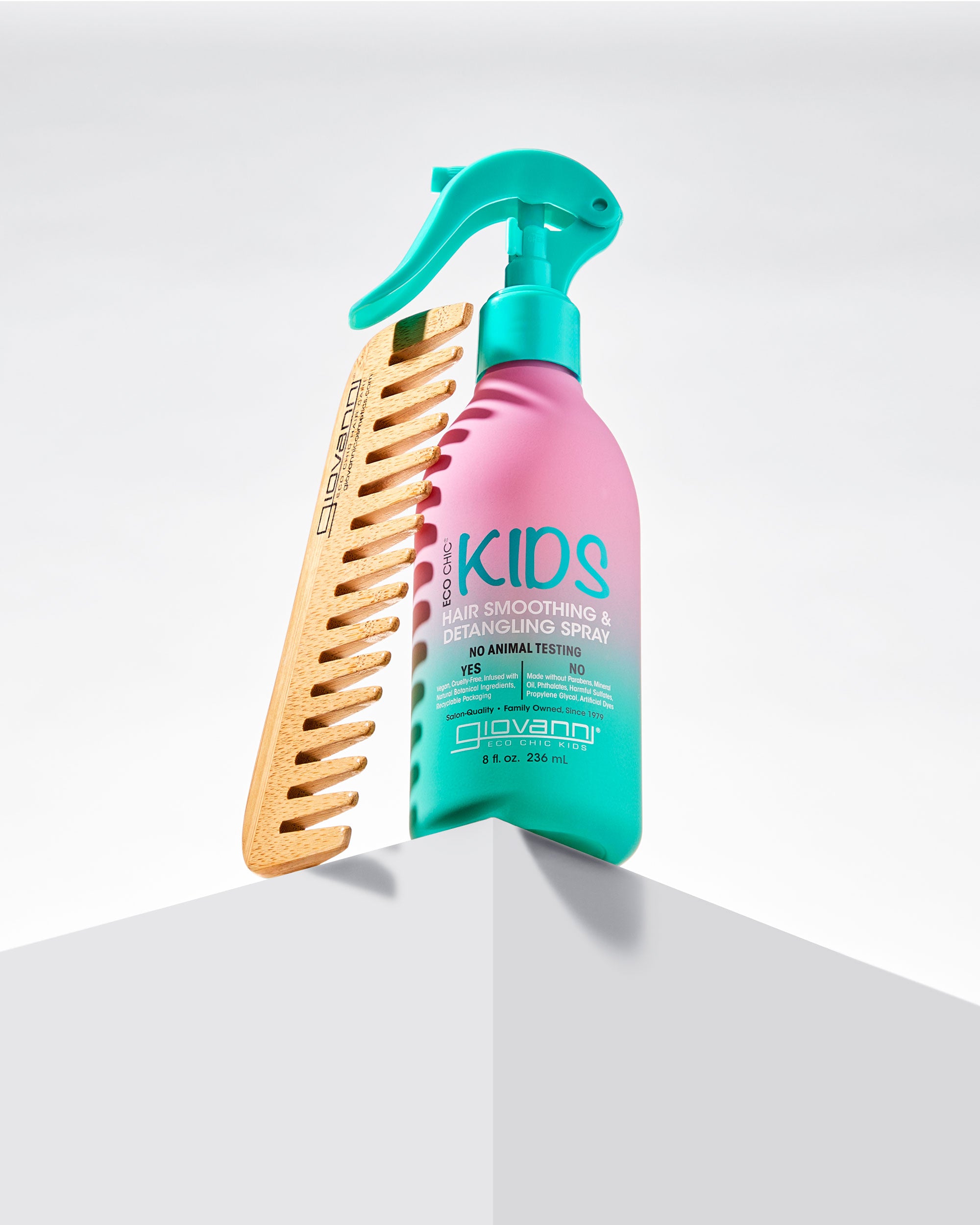 Giovanni comb and Kids hair care product on a white background