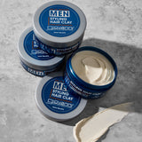Jars of Giovanni Men Styling Hair Clay on a gray surface
