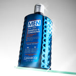 Blue bottle of Giovanni Men's shampoo and conditioner on a gray background