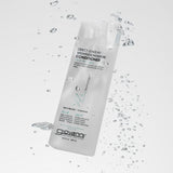 Giovanni Direct Leave-in conditioner bottle with water droplets on a light gray background