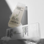 Two bottles of Giovanni hair care products on a gray background