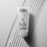 Giovanni hair thickener bottle on a textured white surface