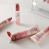 Giovanni 2chic Frizz Be Gone products on a white surface with a mirror in the background