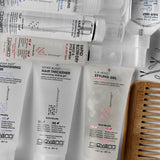 Giovanni hair care products including styling gel and hair thickener on a white background.