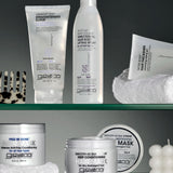 Giovanni hair care products on a glass shelf with a neutral background