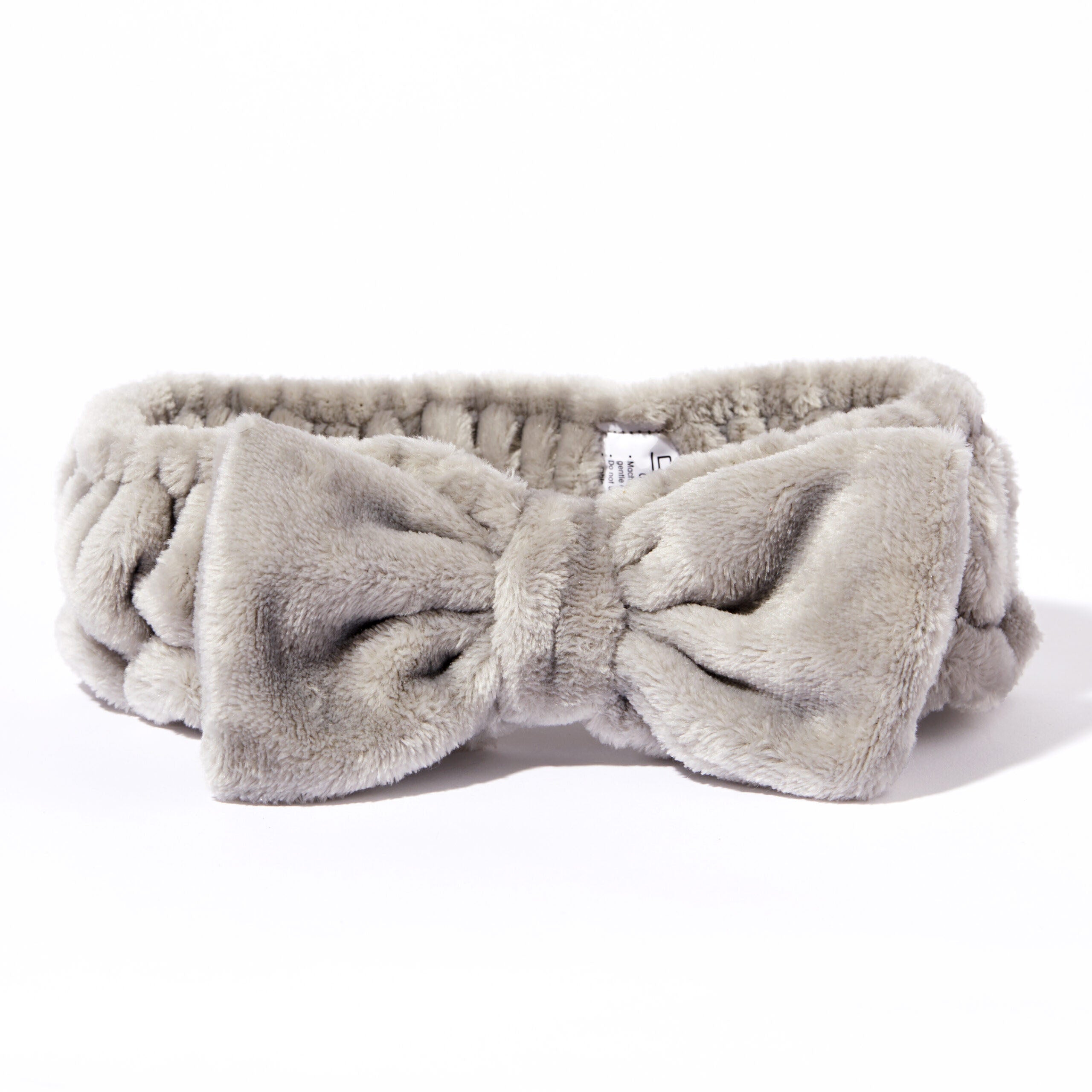 for all types of beauty routines  - The Giovanni Cosmetics PLUSH MULTI-PURPOSE SPA HEADBAND (gray) features soft, plush fabric with a large front bow and a non-slip elastic band—perfect for your beauty routine, shown against a white background.