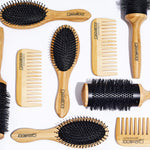 The BAMBOO ALL-PURPOSE DRESSING COMB by Giovanni Cosmetics—crafted for natural hair care—is displayed on a white background. This sustainable styling tool features the Giovanni logo and an eco-friendly bamboo design.