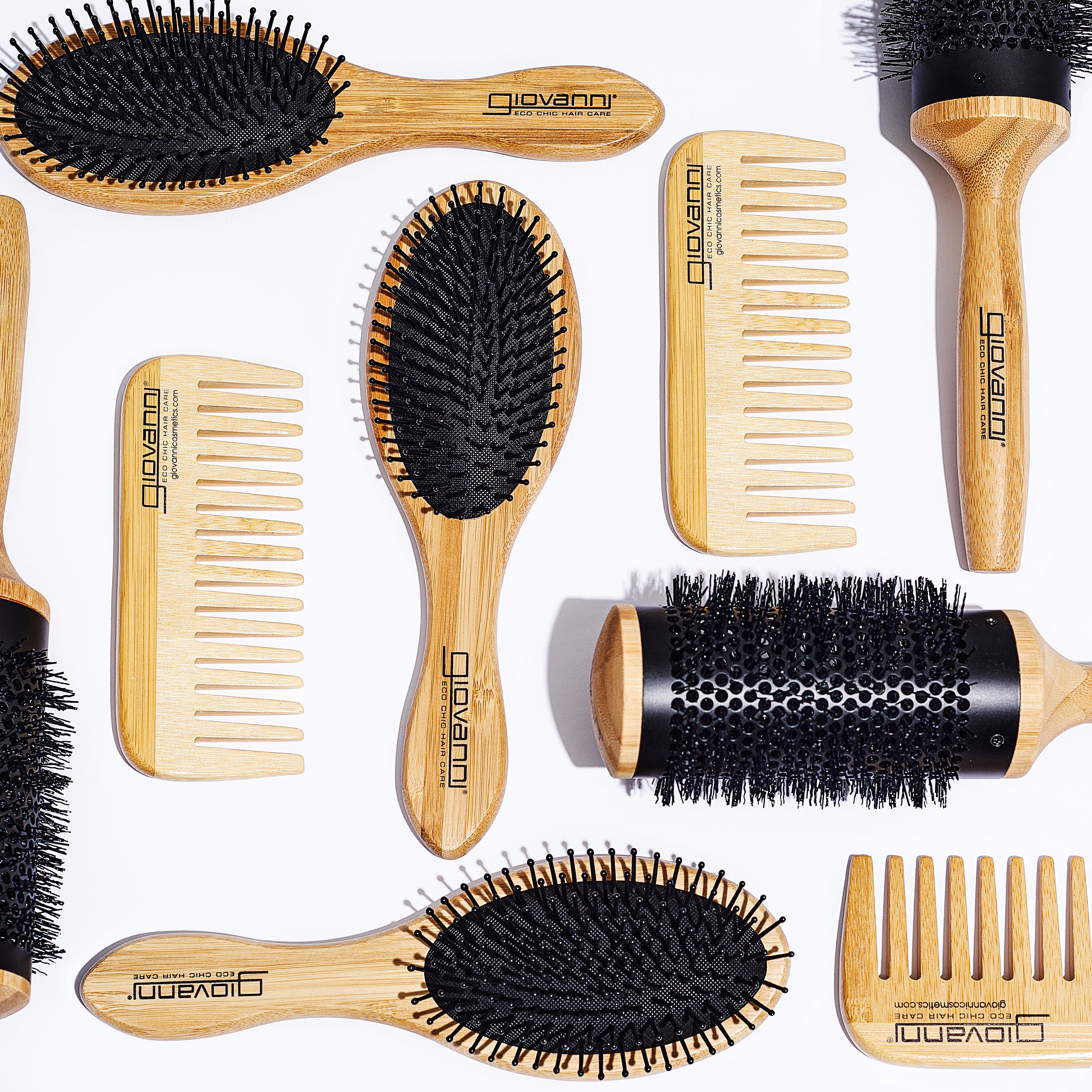 The BAMBOO ALL-PURPOSE DRESSING COMB by Giovanni Cosmetics—crafted for natural hair care—is displayed on a white background. This sustainable styling tool features the Giovanni logo and an eco-friendly bamboo design.