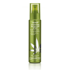 A green spray bottle of Giovanni Cosmetics HEMP HYDRATING BLOW-OUT SPRAY for all hair types, with a cannabis leaf graphic, is vegan, cruelty-free, and uses Hemp Seed Oil for heat protection and frizz control.